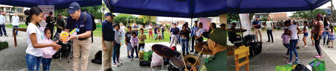 Fotografías del personal de la empresa realizando actividad de entrega del parque, se ven los niños recibiendo regalos y mirando una presentación artística de la Escuela de Policía 